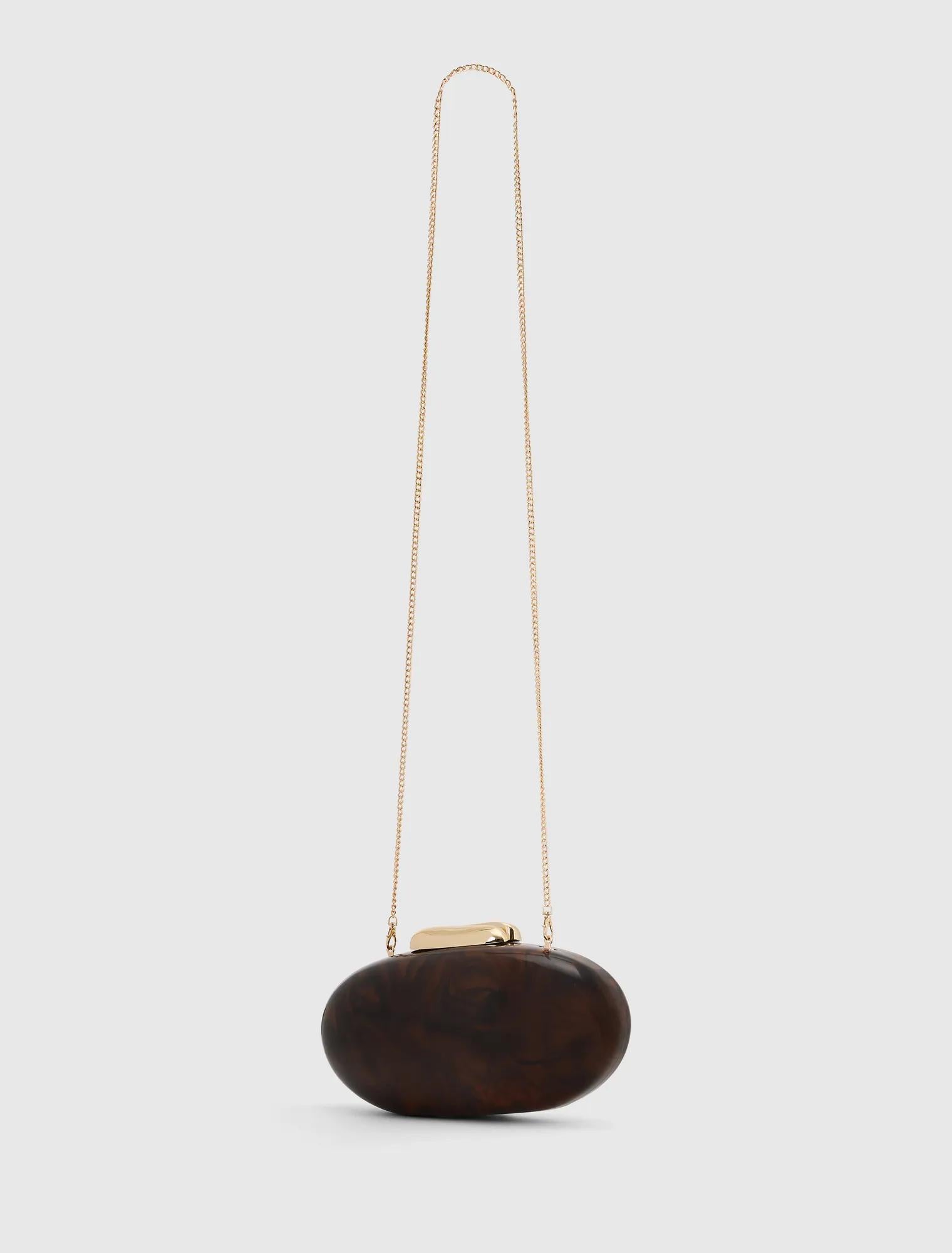 Peyton Oval Hardcase Clutch Tortoise_mannequin