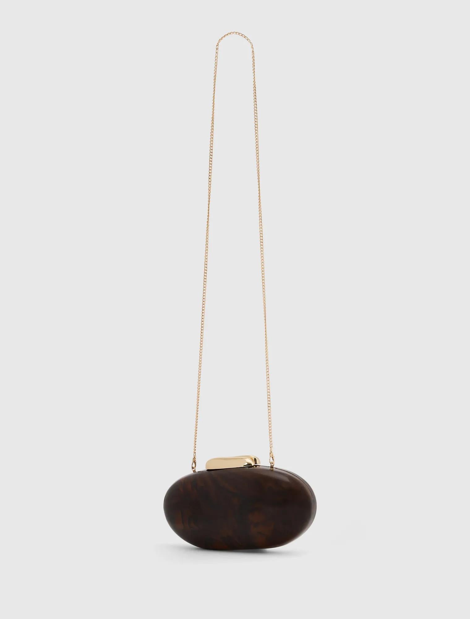 Peyton Oval Hardcase Clutch Tortoise_mannequin