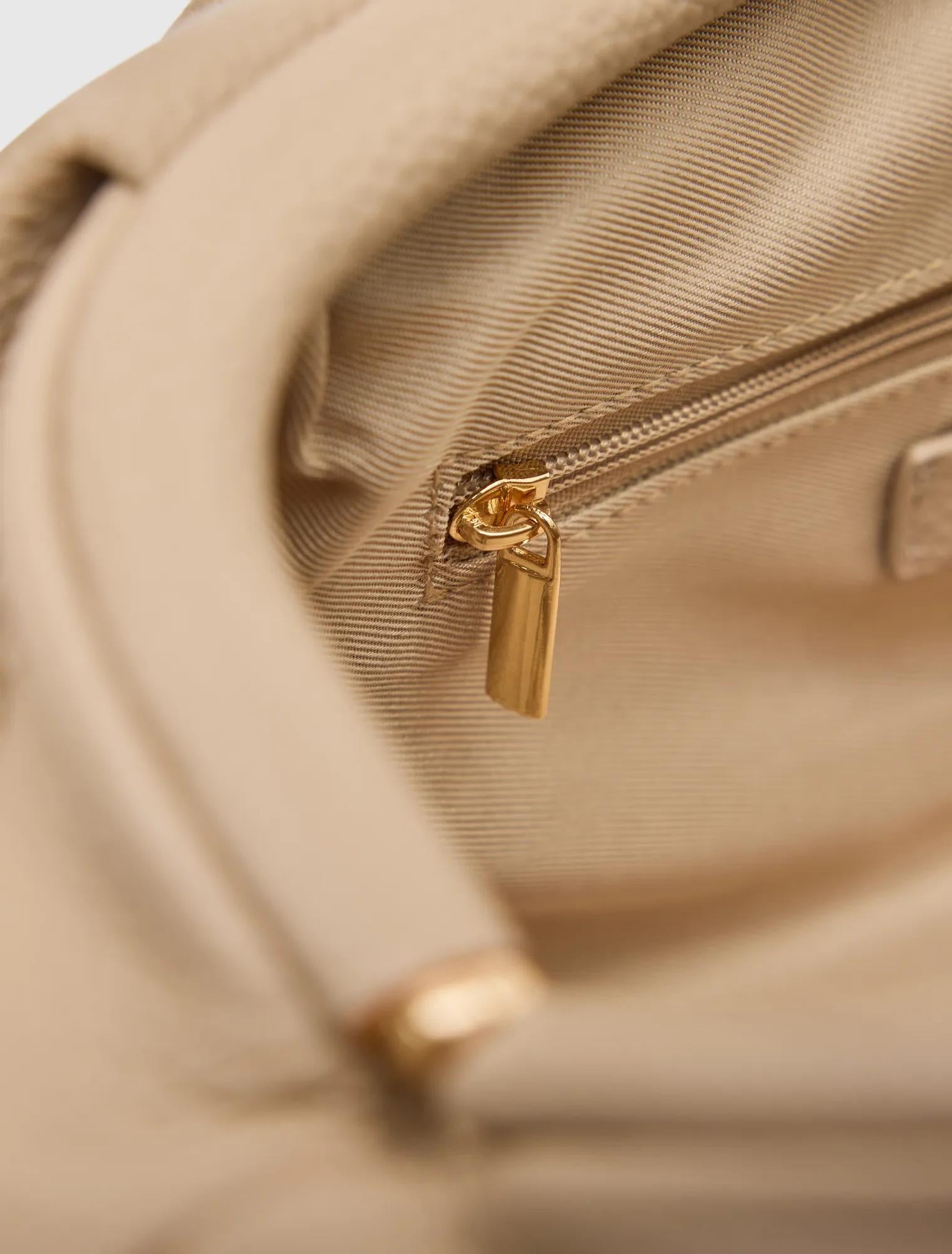 Portia Padlock Soft Clutch oatmeal_mannequin