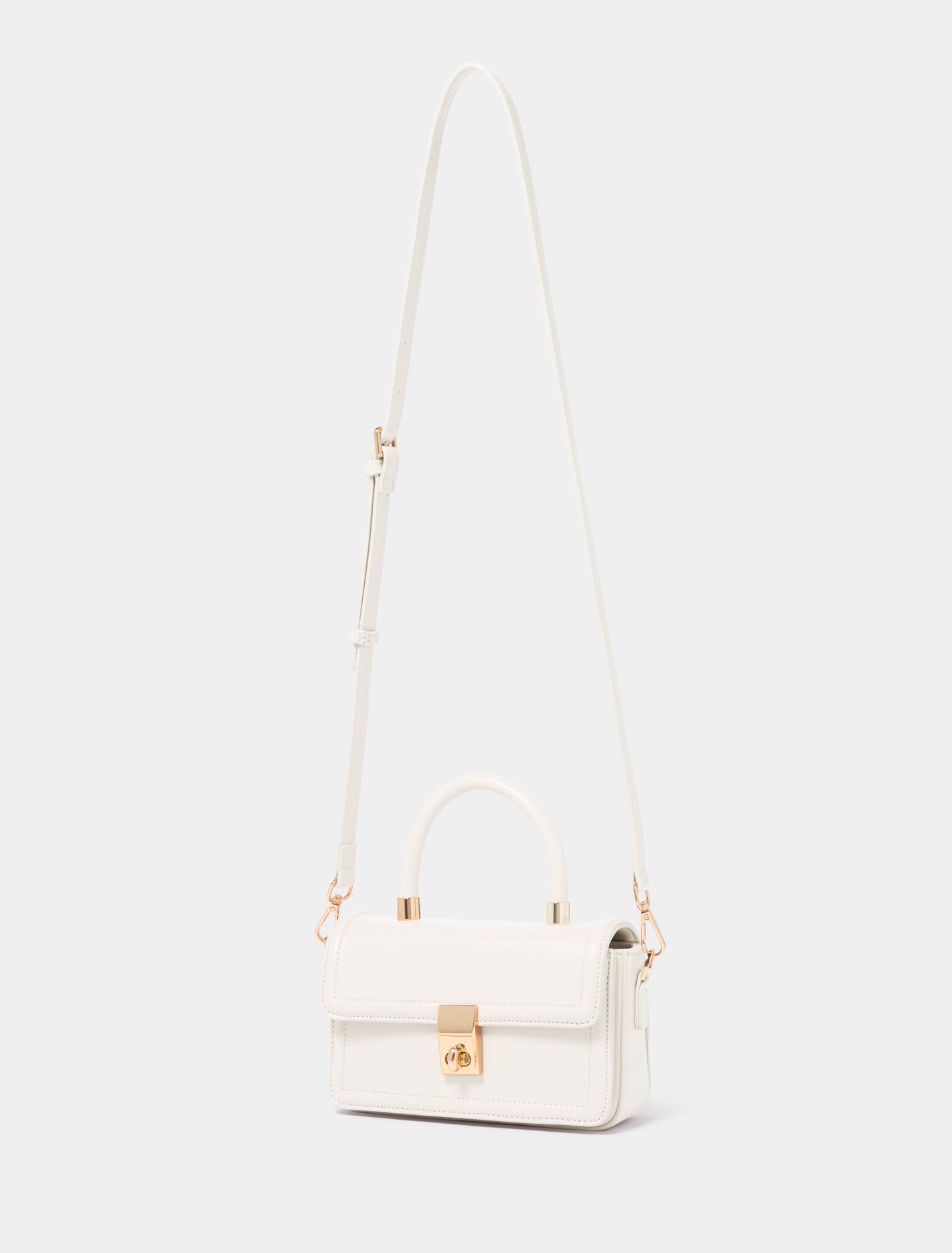 Percy Mini Lock Top Handle Bag Ivory_mannequin